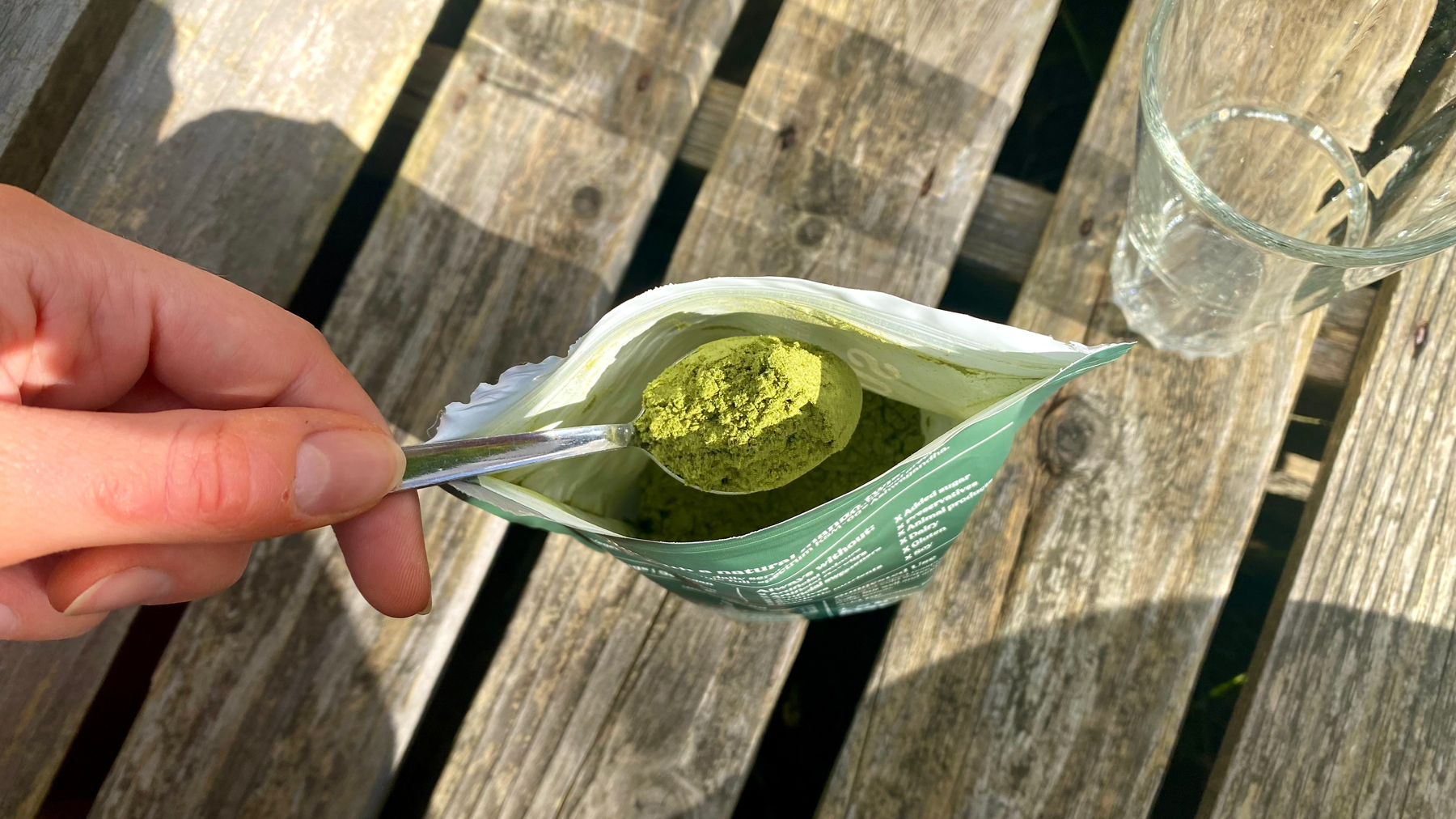 A photo of a spoonful of greens powder