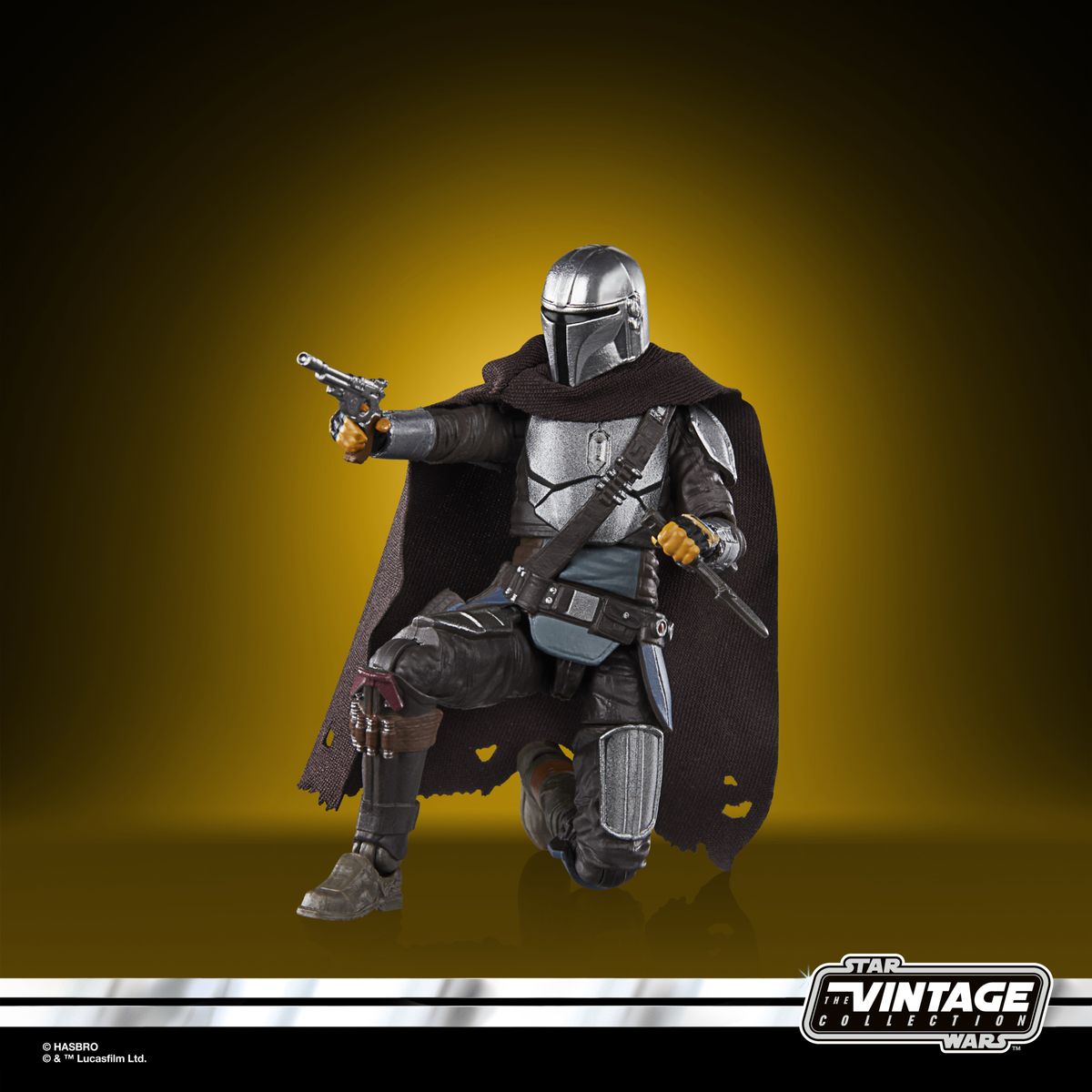 The Vintage Collection Mandalorian figure, posed on a yellow and black background