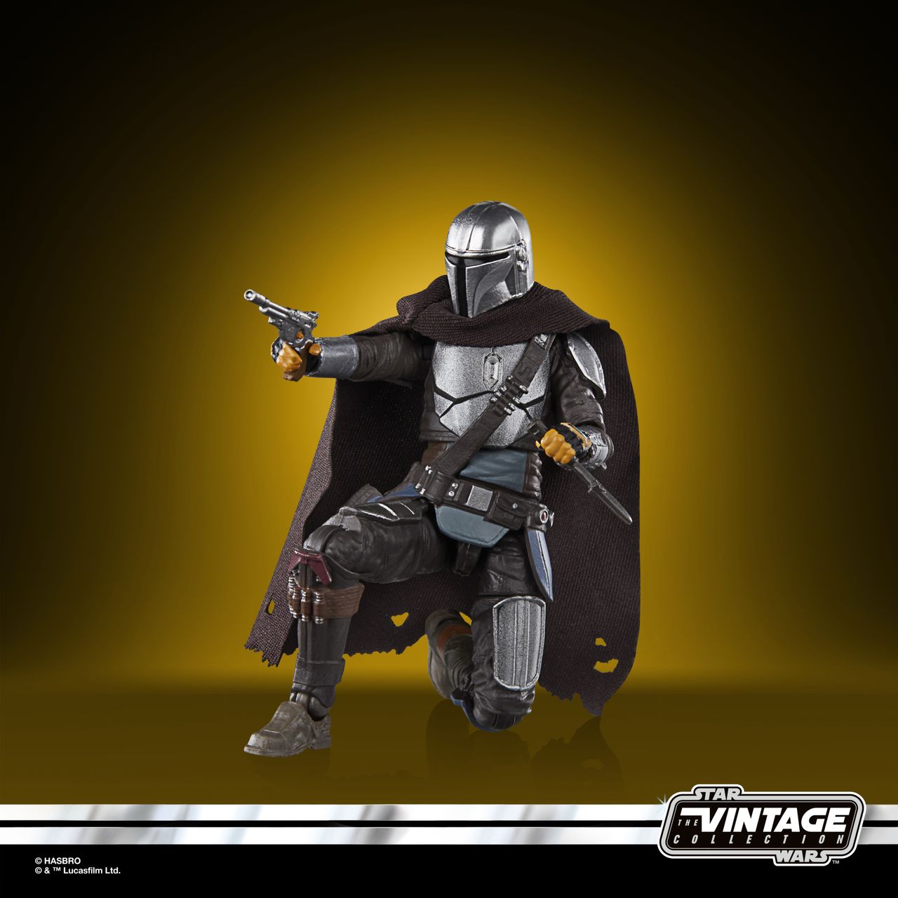 The Vintage Collection Mandalorian figure, posed on a yellow and black background