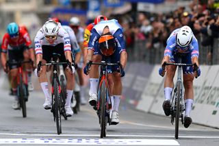 SANREMO ITALY MARCH 16 Jasper Philipsen of Belgium and Team Alpecin Deceuninck crosses the finish line as race winner R ahead of Tadej Pogacar of Slovenia and UAE Team Emirates L Michael Matthews of Australia and Team Jayco AlUla C during the 115th MilanoSanremo 2024 a 288km one day race from Pavia to Sanremo UCIWT on March 16 2024 in Sanremo Italy Photo by Dario BelingheriGetty Images