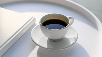 A cup of coffee on a white table