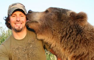 Naturalist Casey Anderson and his adopted bear Brutus. Brutus was the best "man" at Anderson's wedding. 