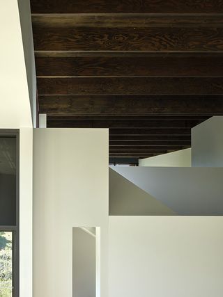 A simple material and colour pallete inside helps bring out the interior architecture's sculptural qualities