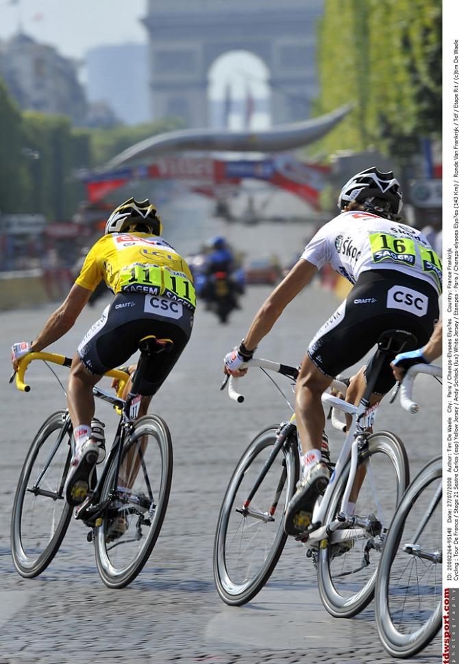 Andy Schleck follows 2008 Tour champion and teammate Carlos Sastre on the Champs-Elysees