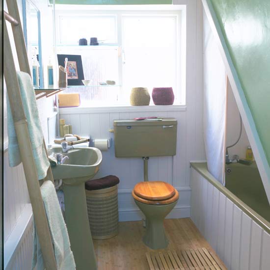 bathroom with toilet and wooden floor