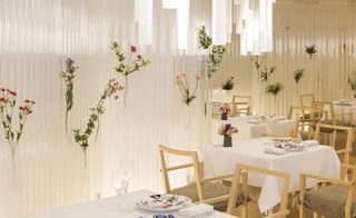 light, white and floral restaurants with hanging cylinder waves