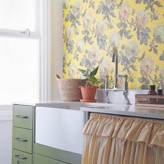 Green kitchen with yellow curtain and yellow floral wallpaper