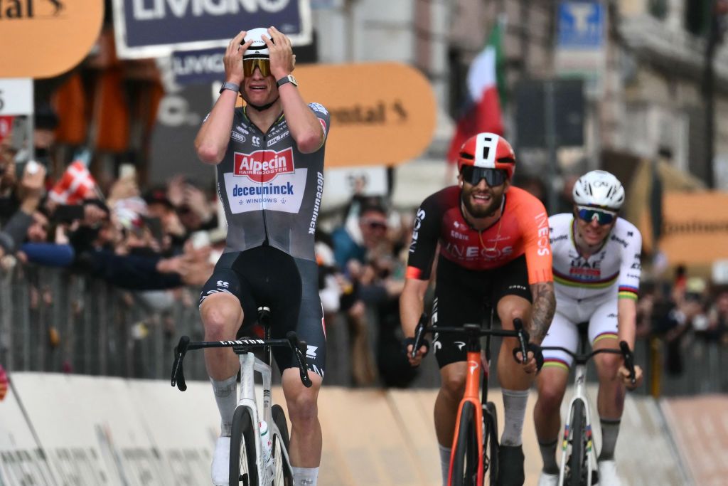 Dutch Mathieu Van Der Poel of team Alpecin-Deceuninck celebrates as he crosses the finish line to win the Milan - Sanremo one-day classic cycling race, on March 22, 2025. Dutch Mathieu Van Der Poel of team Alpecin-Deceuninck won the race ahead of Team Ineos' Italian rider Filippo Ganna and Team UAE's Slovenian rider Tadej Pogacar, third. (Photo by Marco BERTORELLO / AFP)