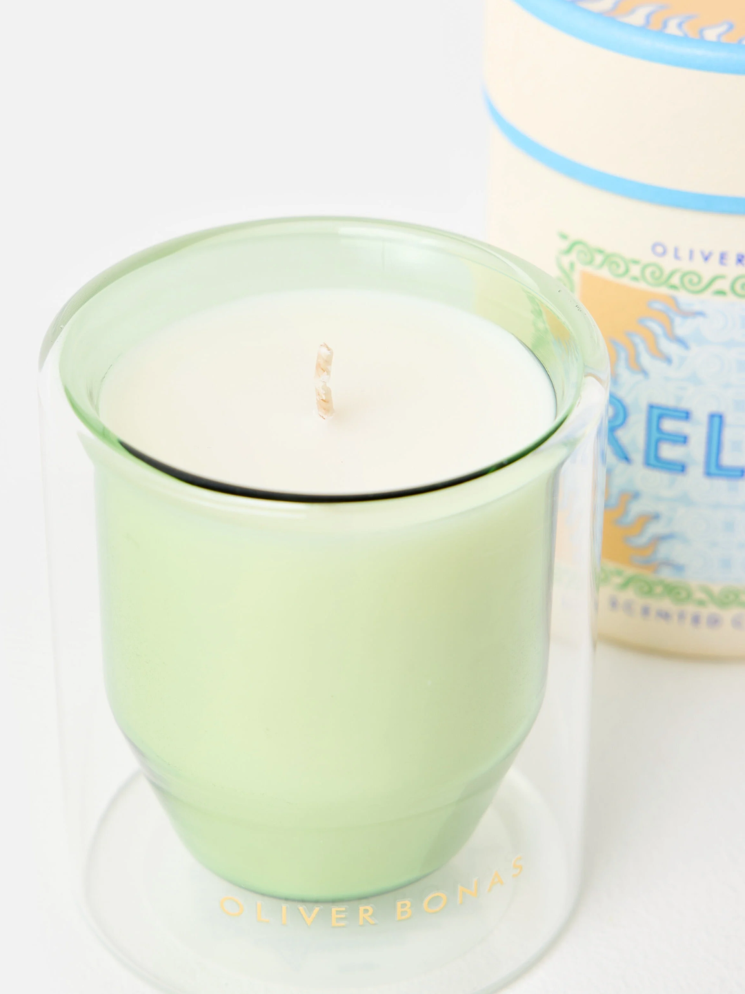 A sage green and glass double walled scented candle from Oliver Bonas