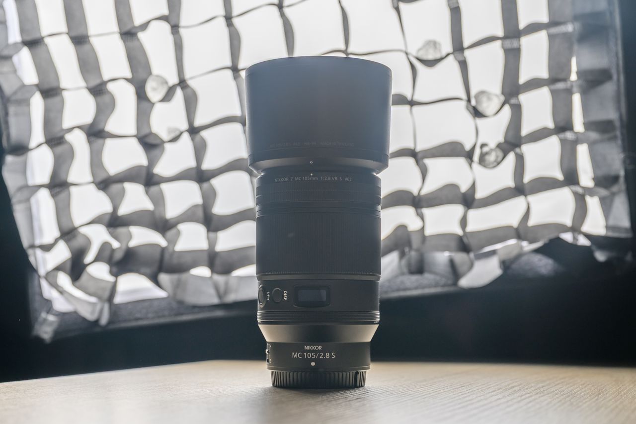 A photo of a backlit Nikon lens