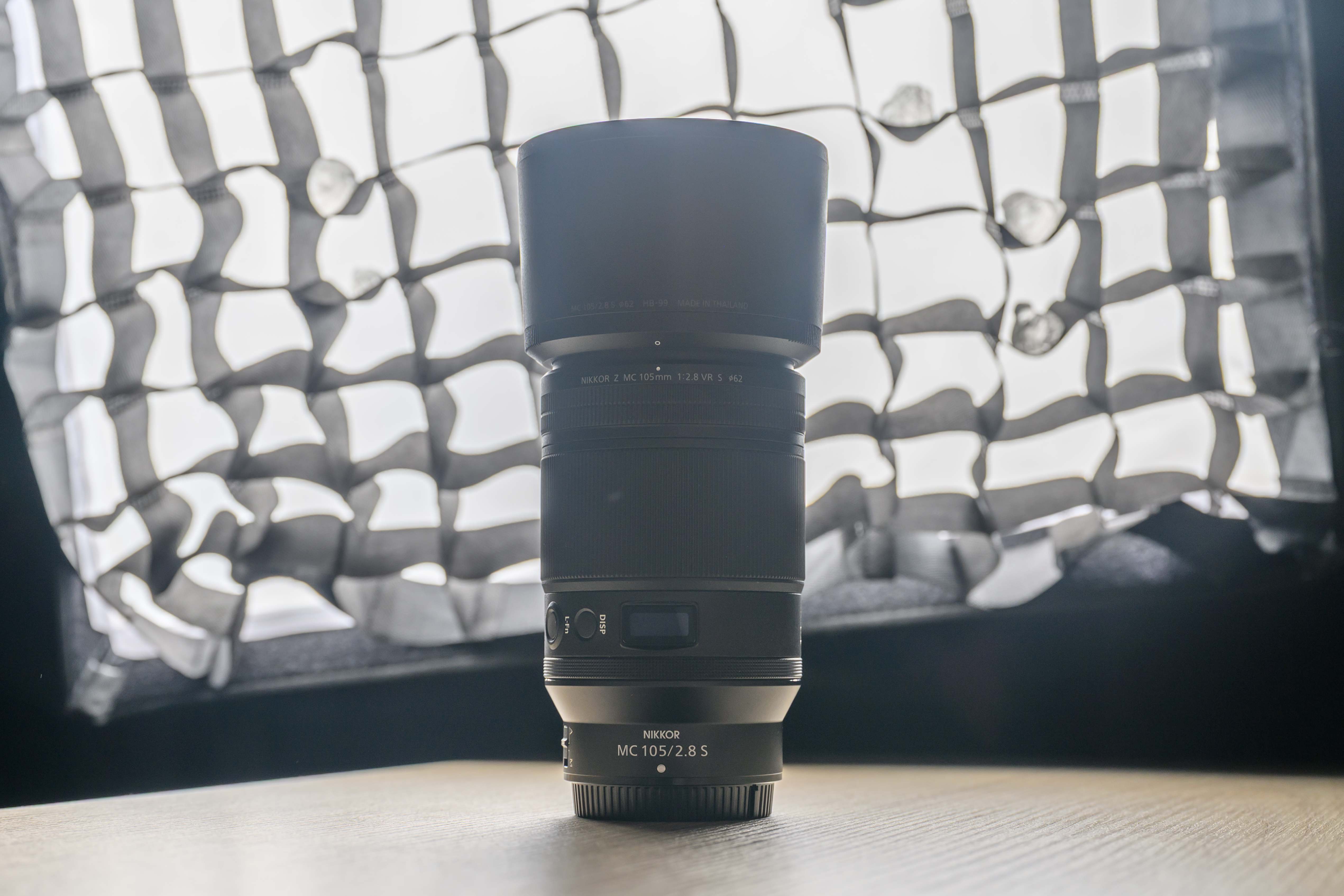 A photo of a backlit Nikon lens