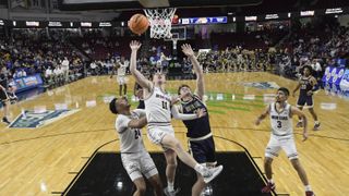Brian Goracke #21 of the Montana State Bobcats jumps up towards the hoop ahead of the the March Madness First Four 2024 
