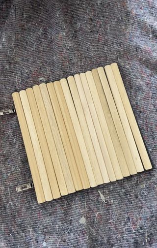 Door with wooden dowel strips stuck to it