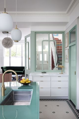 A kitchen with blue door frame