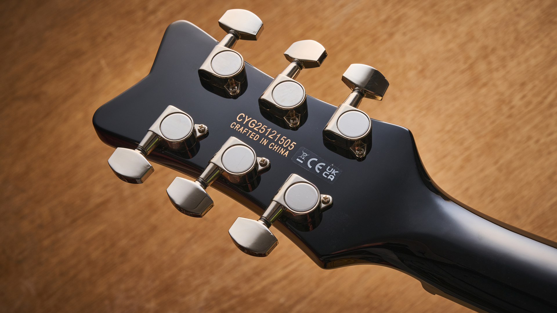 Gretsch Electromatic CVT Baritone in Bristol Fog brown sunburst finish shot on wood.