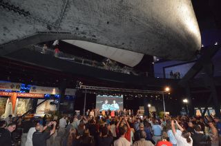 Space shuttle Atlantis appears to soar overhead during the 2014 U.S. Astronaut Hall of Fame induction ceremony honoring Shannon Lucid and Jerry Ross at NASA’s Kennedy Space Center Visitor Complex in Florida on May 3, 2014.