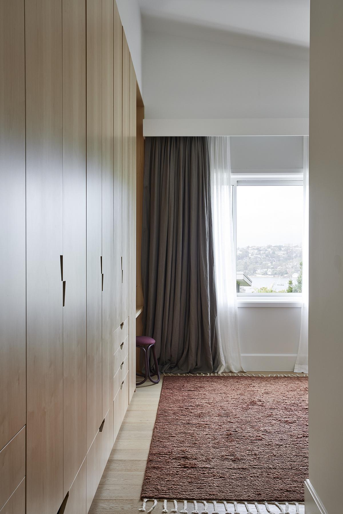 A bedroom curtain with pelmet box over the double curtain rod