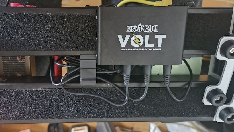 The underside of the D&rsquo;Addario XPND 1 pedalboard showing an Ernie Ball Volt power supply mounted
