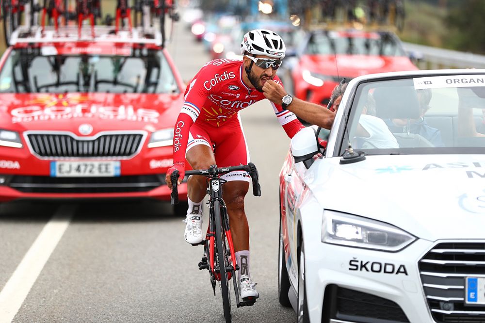 Nacer Bouhanni (Cofidis) at Overall leader Simon Yates (Mitchelton-Scott) at the start of stage 11 at the Vuelta a Espana