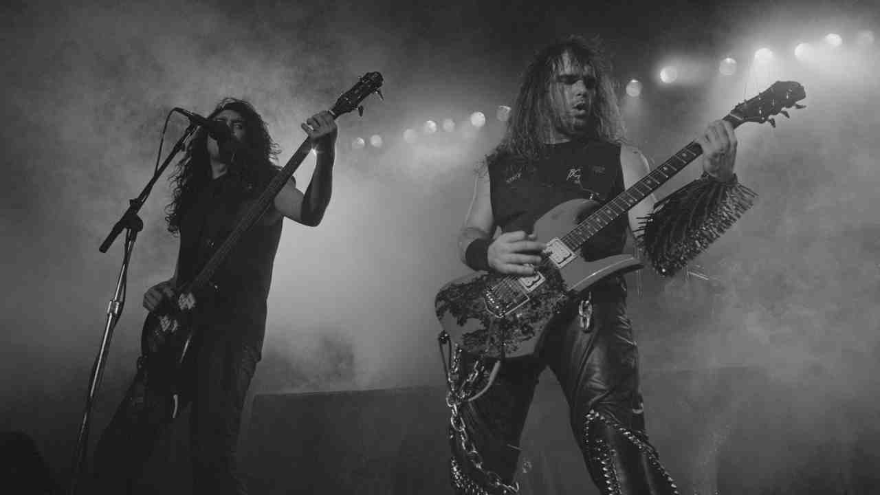 Slayer performing onstage in 1986