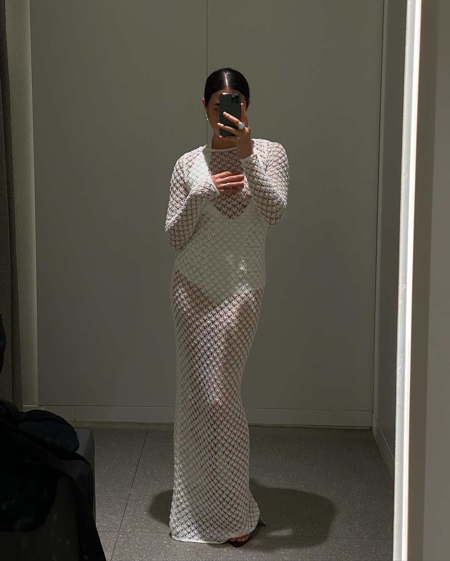 Sasha Mei wearing a sheer crochet maxi dress from Victoria Beckham x Mango.