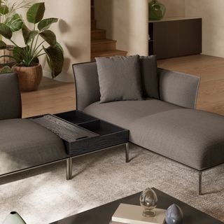 ‘Eufolia’ sofa in brown fabric, with a metal base.
