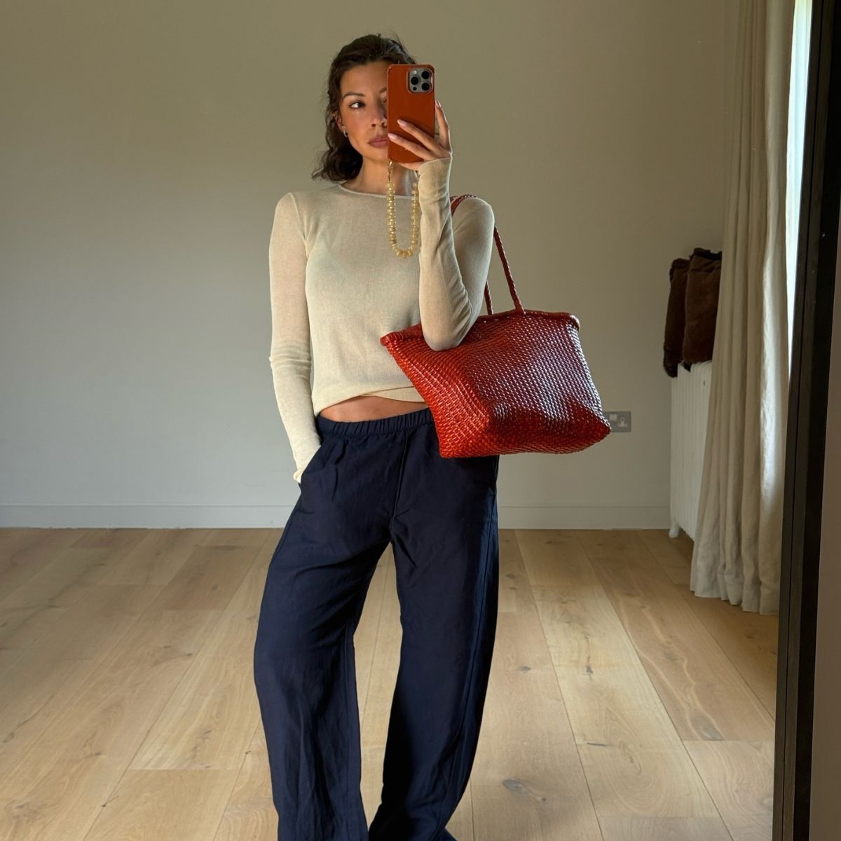 Marianne wearing linen trousers and top