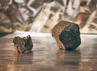 An iron meteorite from the core of a melted planetesimal (left) and a chondrite meteorite, derived from a ‘primitive’, unmelted planetesimal (right).