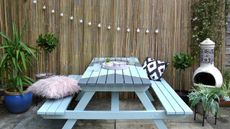 Garden upcycle idea with paint effect on old picnic table 