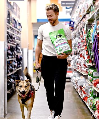 derek hough with his dog luna and greenies treats