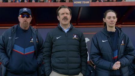 Coach Beard, Ted, and Alice looking at something from the touchline in Ted Lasso season 4 episode 8