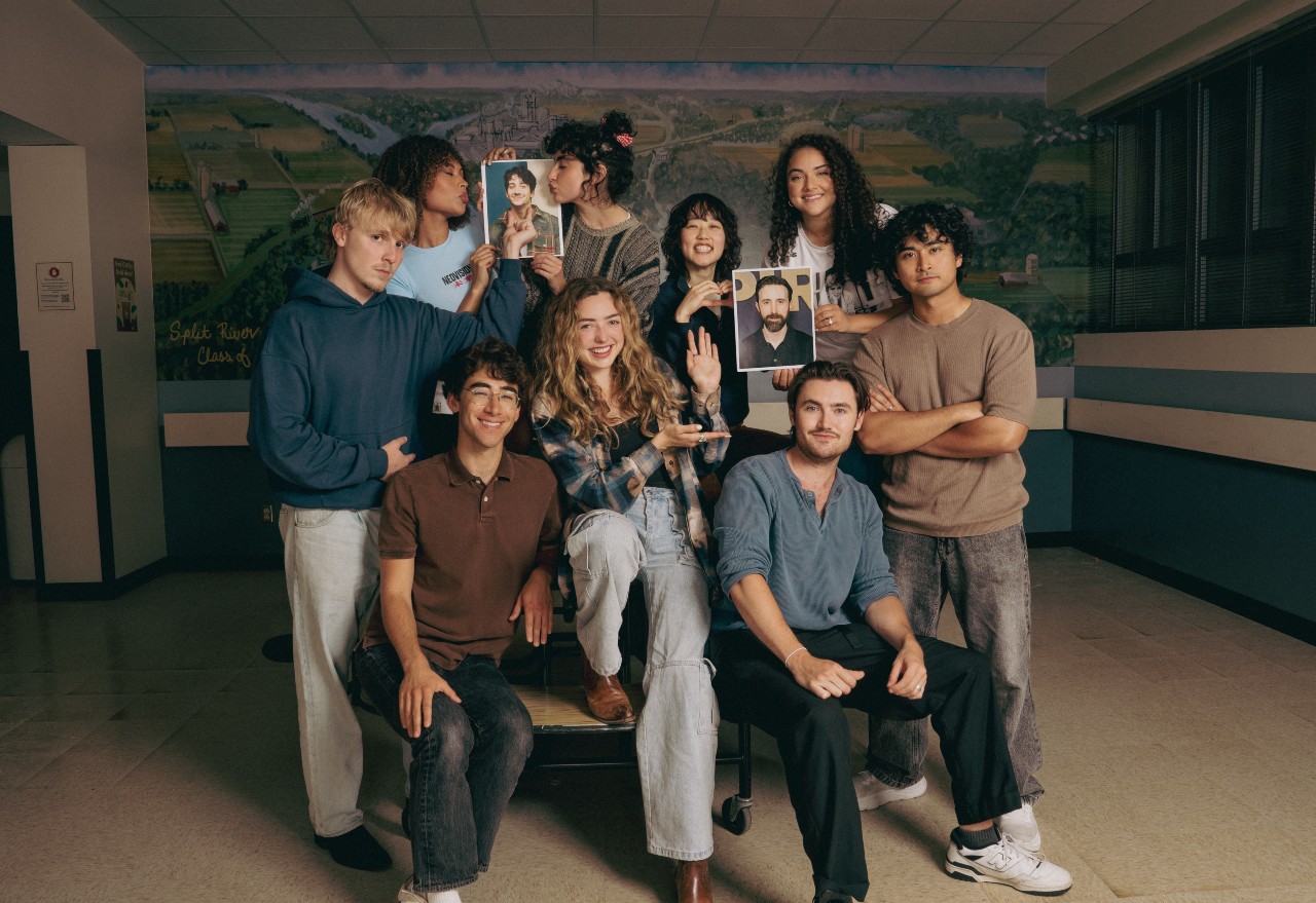 L-R: Miles Elliot, Rainbow Wedell, Nick Pugliese, Sarah Yarkin, Peyton List, Ci Hang Ma, Spencer Macpherson, Kiara Pichardo and Kristian Ventura. Milo Manheim and Josh Zuckerman are photos being held up by the cast.