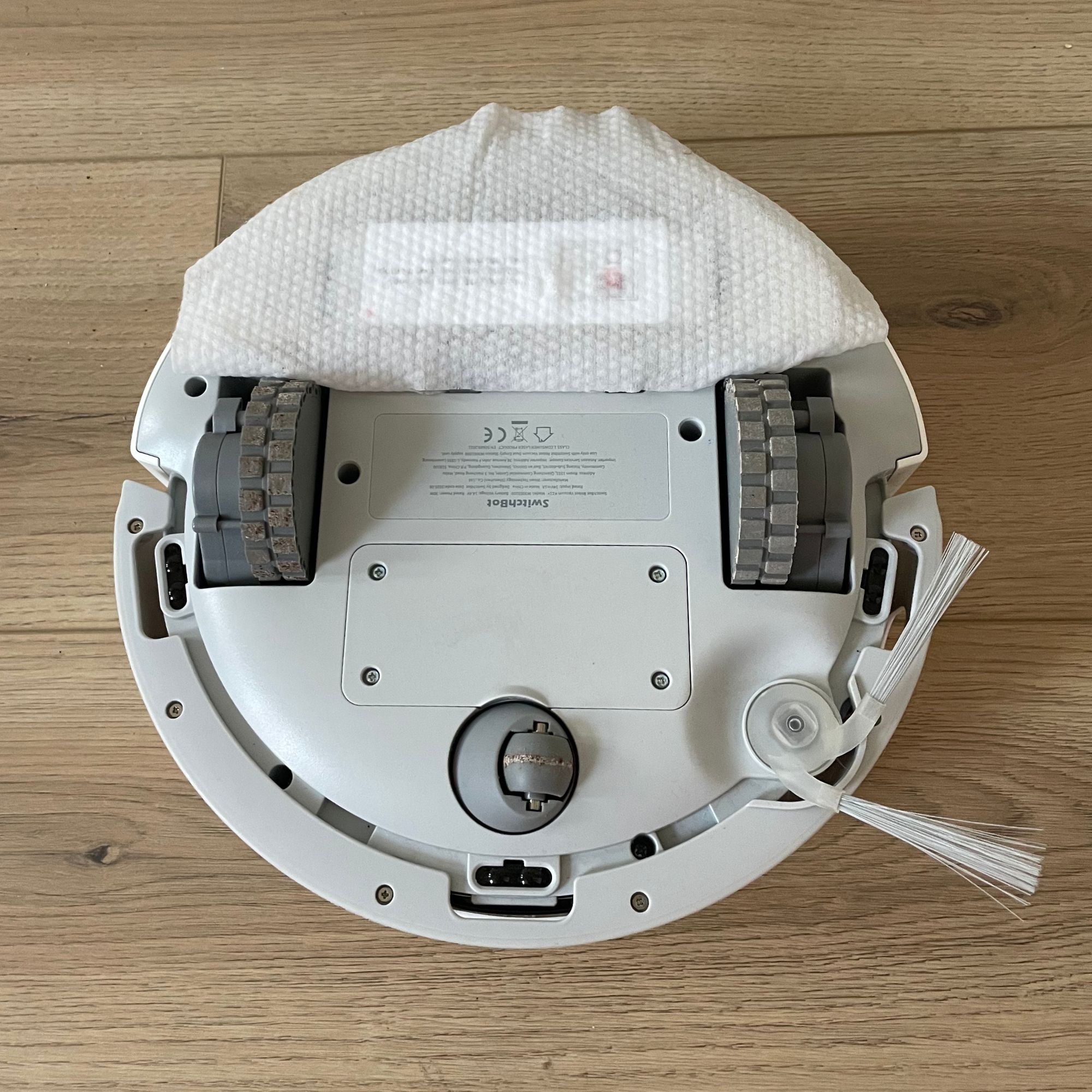 Underside of the SwitchBot K11+ Robot Vacuum Cleaner with Mop with a mop on it