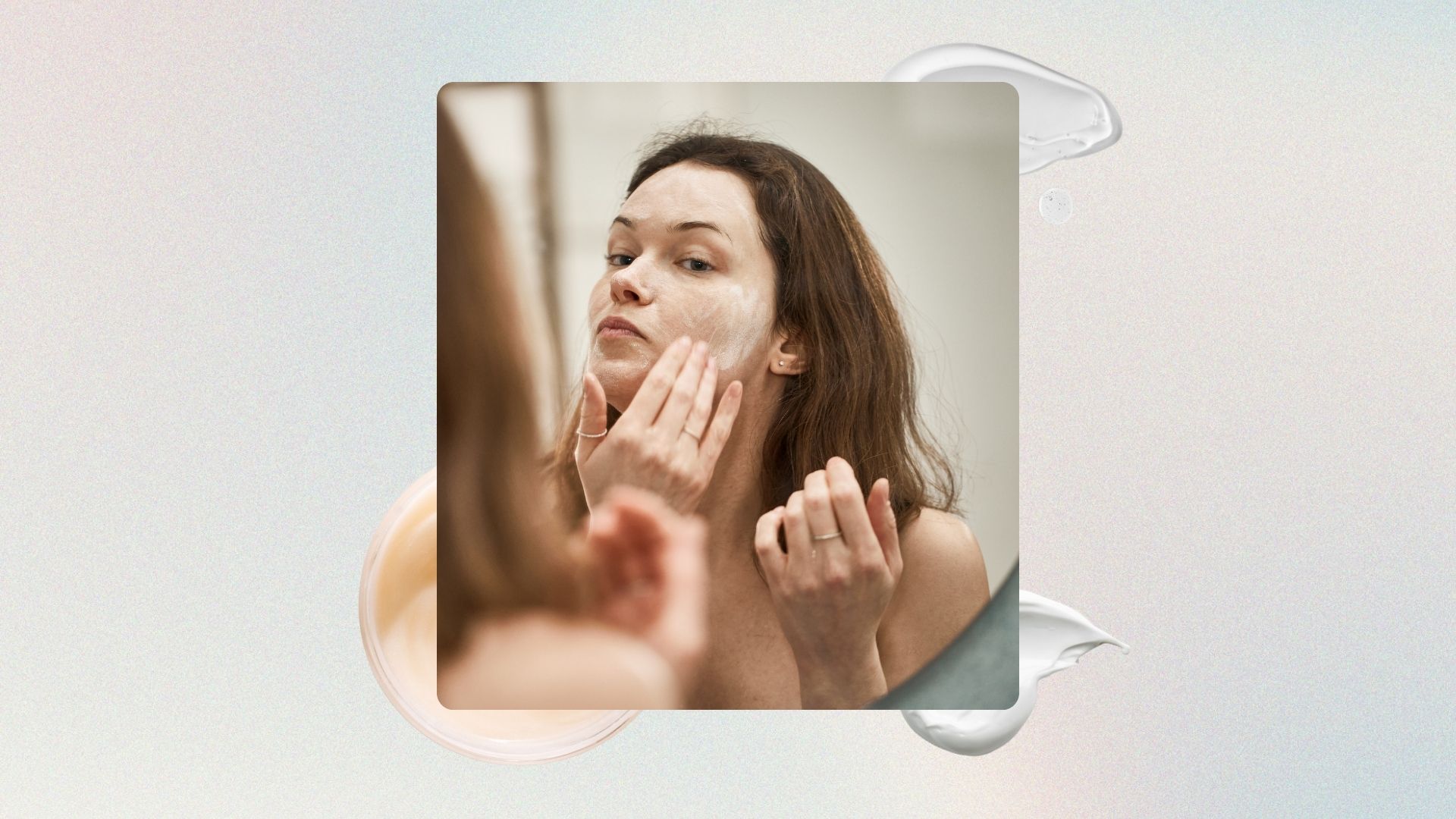 A woman washing her face with a creamy cleanser