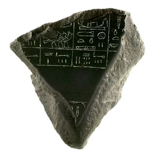 A fragment of the Palermo Stone, a block of basalt inscribed with the names of early Egyptian kings.