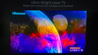 The Hisense L9Q projecting colourful planets