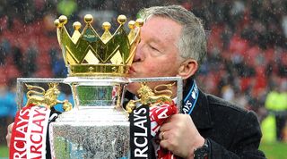 Sir Alex Ferguson celebrates with the Premier League trophy, his last piece of silverware as Manchester United manager, in May 2013.