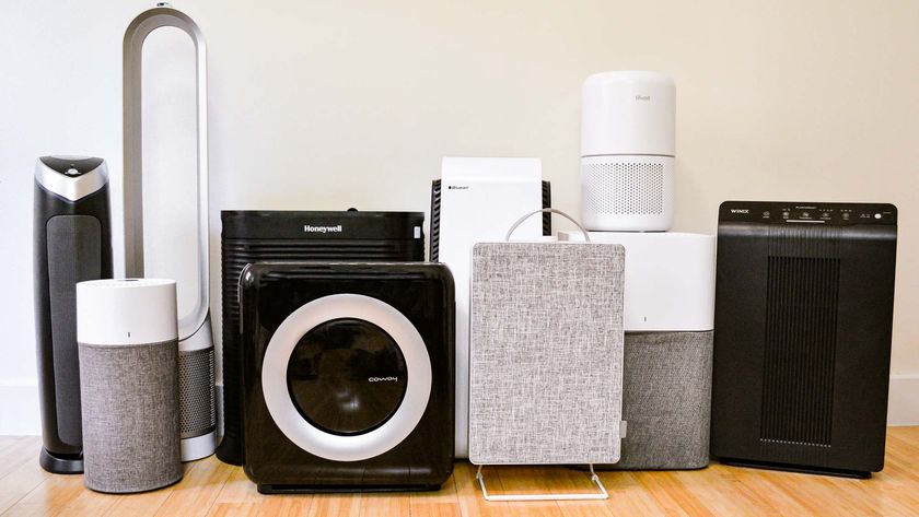 A line up of the air purifiers tested by Tom&#039;s Guide on a wooden floor against a white wall