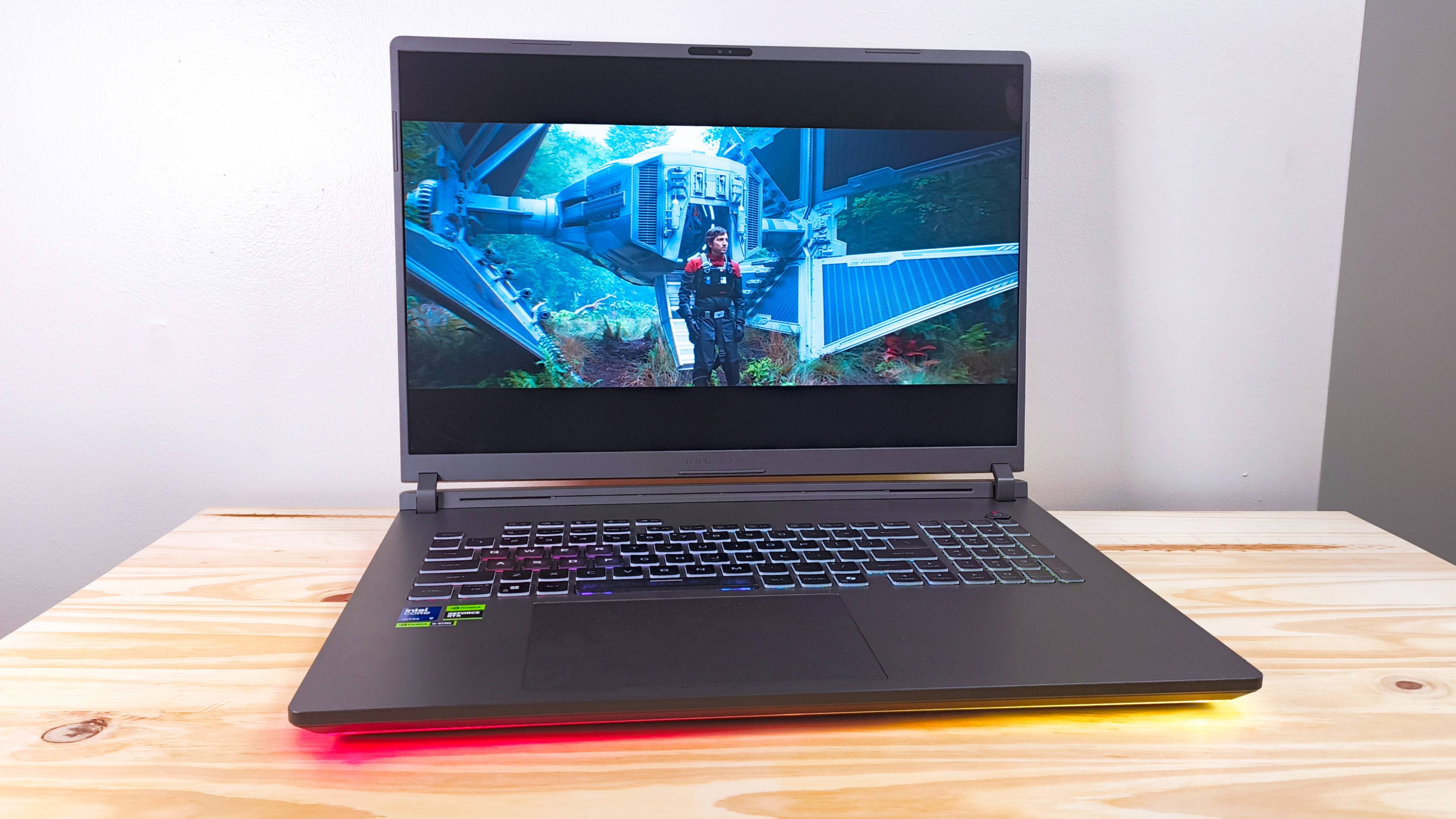 The Asus ROG Strix G18 playing an episode of Andor (Disney) on a wood table