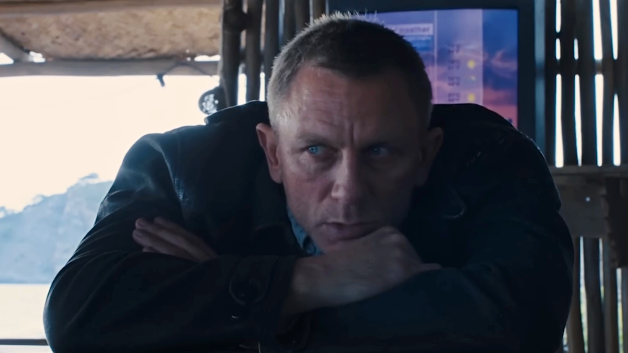 James Bond looking sad, sitting at a bar in Skyfall