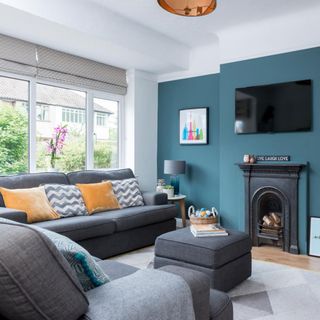 Blue living room with grey retro style sofa