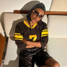 A woman wearing a jersey top