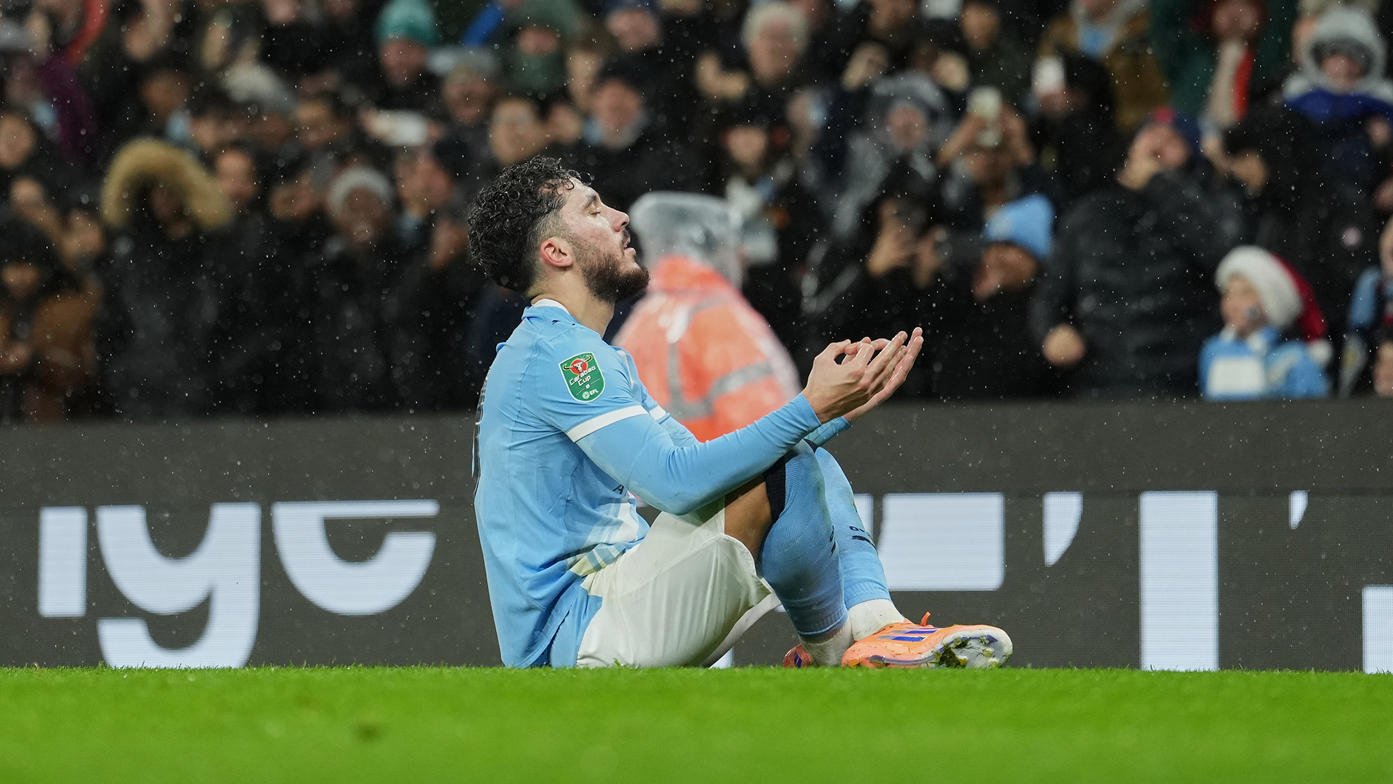 Midfielder Rayan Cherki poses after scoring during an English League Cup match between Manchester City and Brentford in Manchester, England