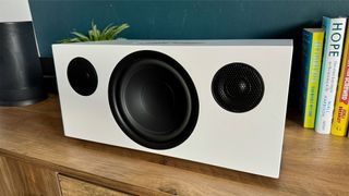 Audio Pro C20 wireless speaker on wooden furniture