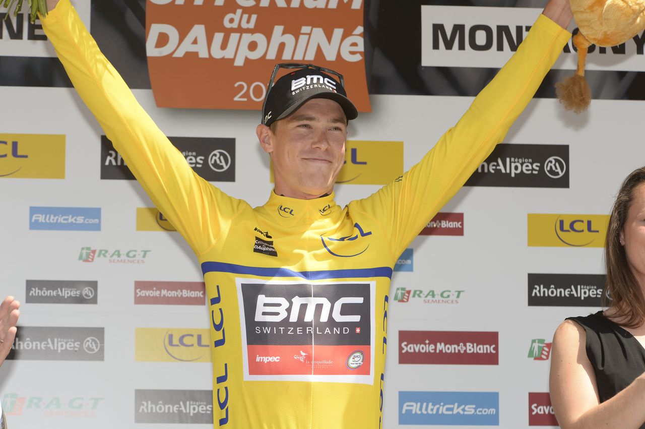 New race leader Rohan Dennis celebrates atop the podium