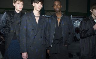 Male models wearing Dries van Noten clothing