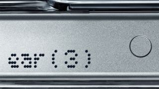 Teaser image: a close up of "ear (3)" on what is presumably the Nothing Ear (3) charging case