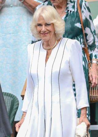 Queen Camilla wearing a striped coat dress for Wimbledon 2023