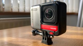 Insta360 ONE RS photographed on a wooden table