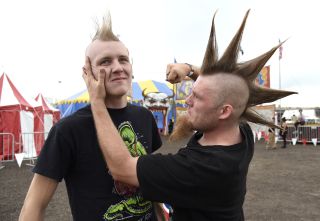 Two punks resolving their differences at Riot Fest